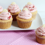 platter of White Chocolate Cupcake with swirls of Strawberry Buttercream