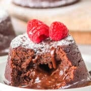 A decadent Chocolate Lava Cake topped with fresh raspberries.