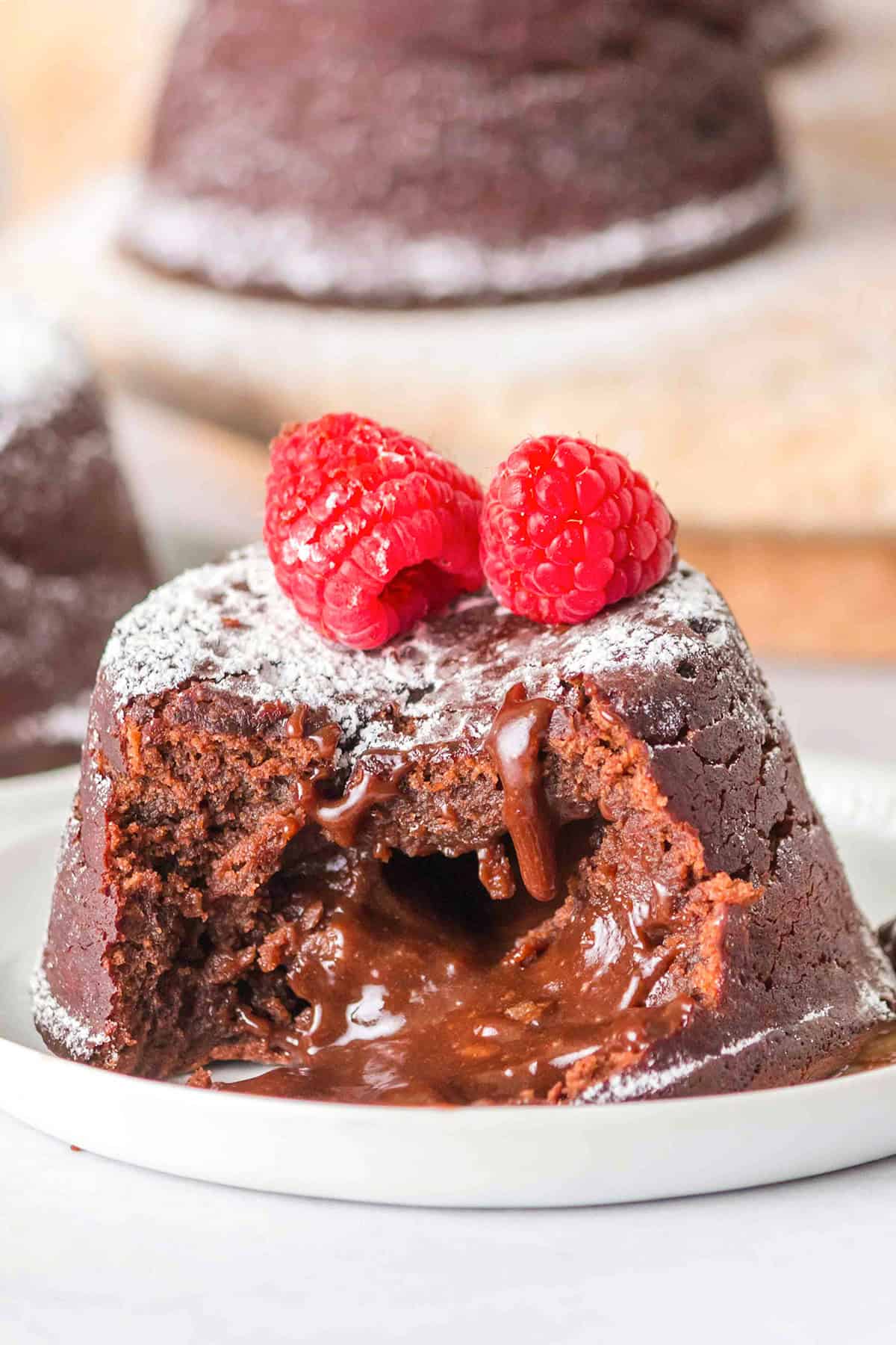 A decadent Chocolate Lava Cake topped with fresh raspberries.