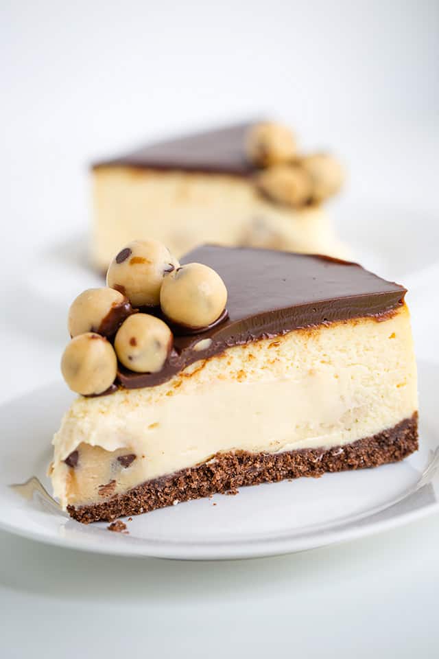 slice of salted caramel cookie dough cheesecake on a white plate