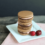 chocolate macaron recipe: chocolate macarons filled with cherry frosting and chocolate ganache