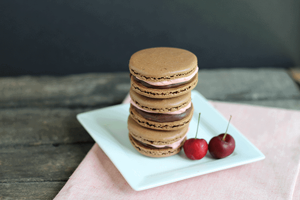 Chocolate Macarons with Cherry Frosting