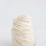 Perfectly piped swirls of swiss meringue buttercream shot from the side
