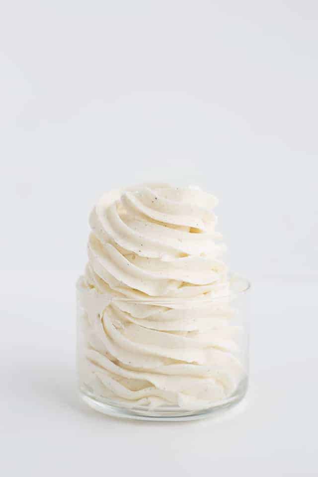 Perfectly piped swirls of swiss meringue buttercream shot from the side