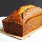 Zucchini bread sitting on a piece of paper.