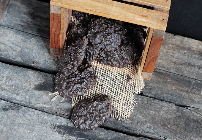 batch of chocolate no bake cookies in a wooden crate