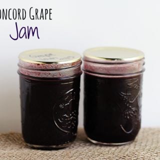 Two jars of concord grape jam.