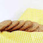 Crumble cookies arranged on a yellow checkered napkin.