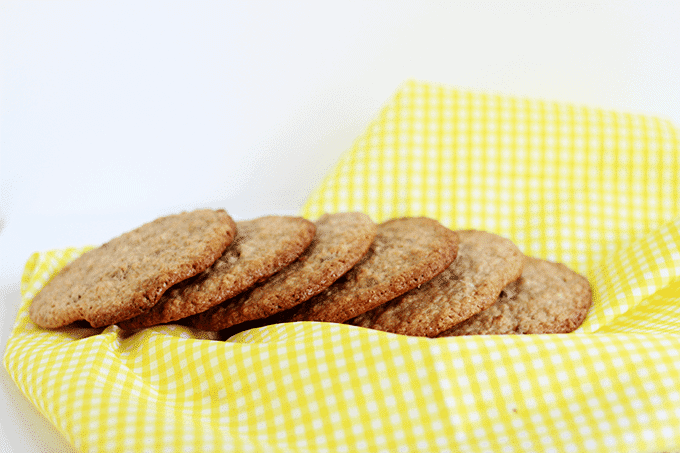 Crumble cookies arranged on a yellow checkered napkin.