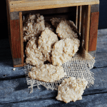 Peanut Butter No-Bakes in a wooden crate on a wooden table.