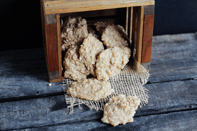 Peanut Butter No-Bakes in a wooden crate on a wooden table.