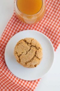 overhead photo of one apple cider snap cookie on white plate