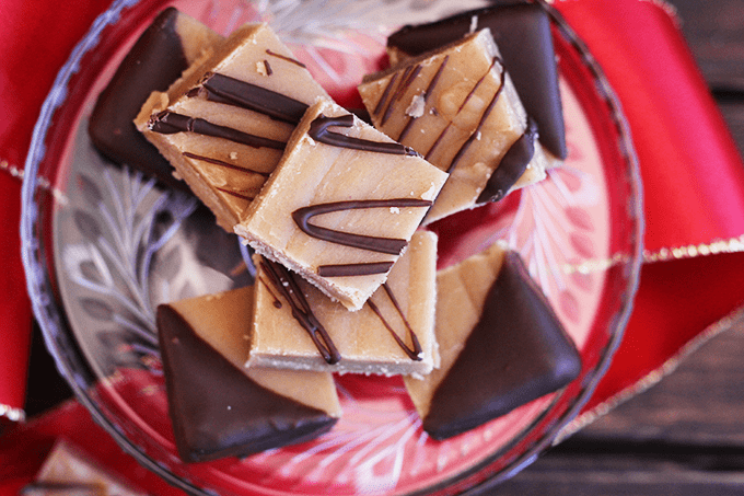 A platter of peanut butter fudge on a crimson dish.