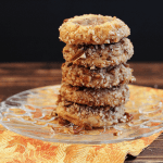 A stack of Pecan Sweet Potato Thumbprint cookies on a plate.
