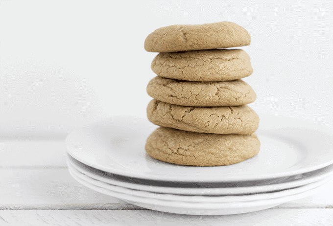 Maple brown sugar cookies stacked on a white plate.