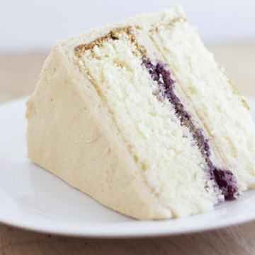 A yellow cake on a plate.