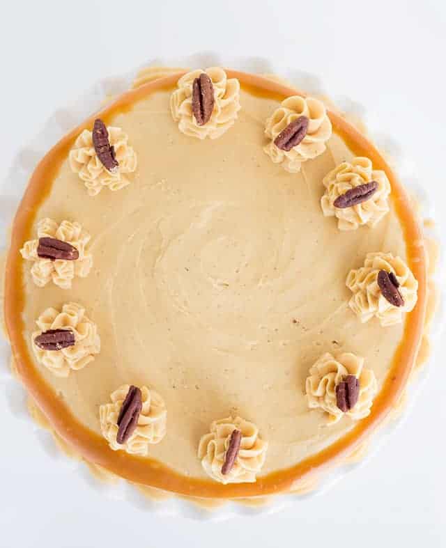 An overhead photo of the carrot cake with caramel buttercream showing the swirls in the frosting and the toasted pecans. 