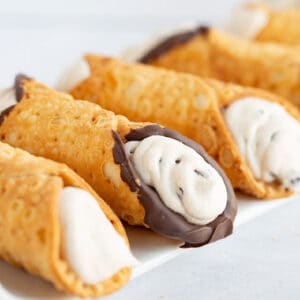 square image of cannoli on a plate