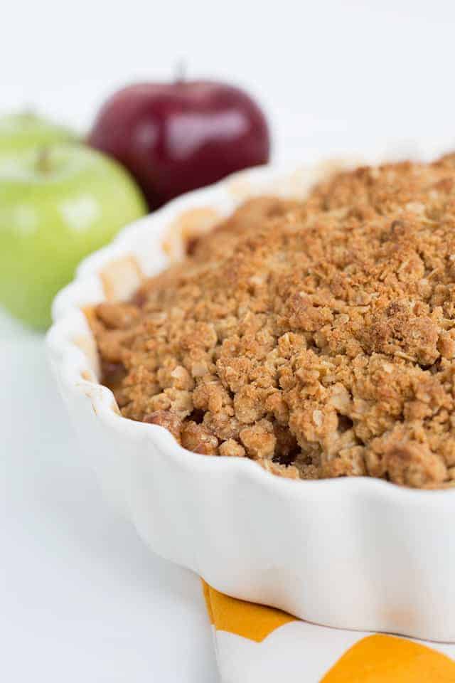 Peanut butter apple crisp in a white dish.