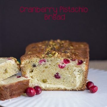 Cranberry pistachio bread on a plate.