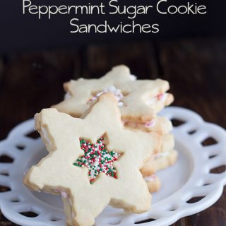 Peppermint sugar cookie sandwiches on a plate.