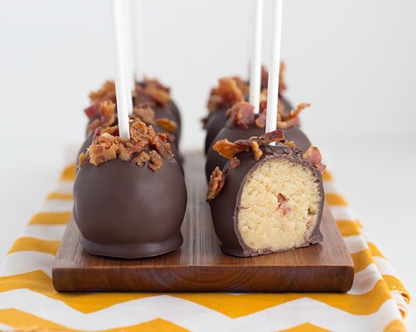 a platter of easy cake pops coated with chocolate and bacon