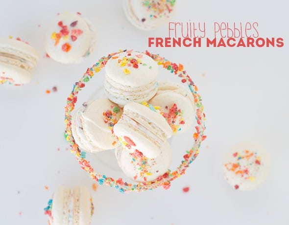 French macarons with Fruity Pebbles sprinkles in a glass bowl.