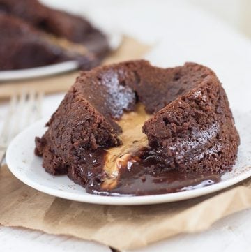 A decadent Peanut Butter Chocolate Lava Cake with a bite taken out of it.