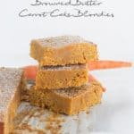 A stack of carrot cake slices topped with browned butter.