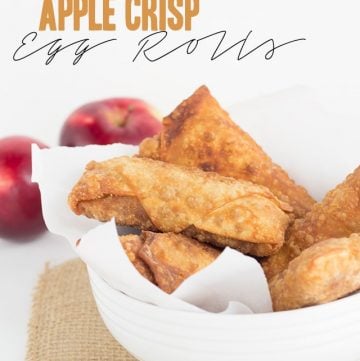 Apple crisp egg rolls in a white bowl.