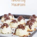 Almond joy macaroons with almond and coconut, arranged on a baking sheet.