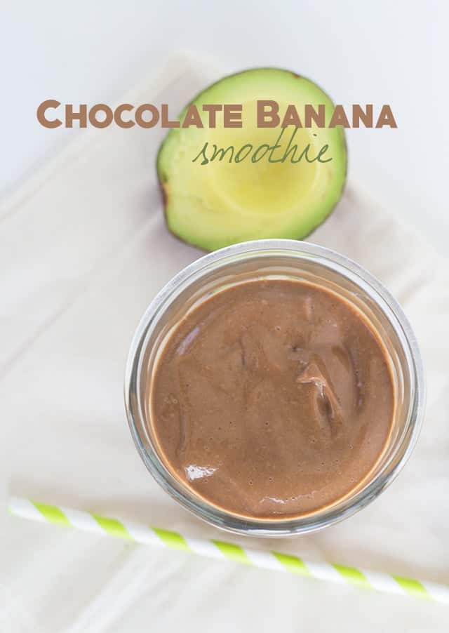 Chocolate avocado smoothie with straw.
