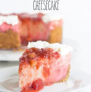 Delicious strawberry rhubarb cheesecake presentation on a pristine white plate.
