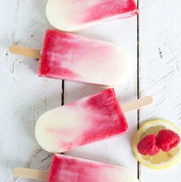 Four raspberry lemonade popsicles.