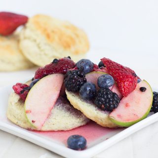 A plate of Redd's Apple Fruit Shortcake biscuits with berries on it.