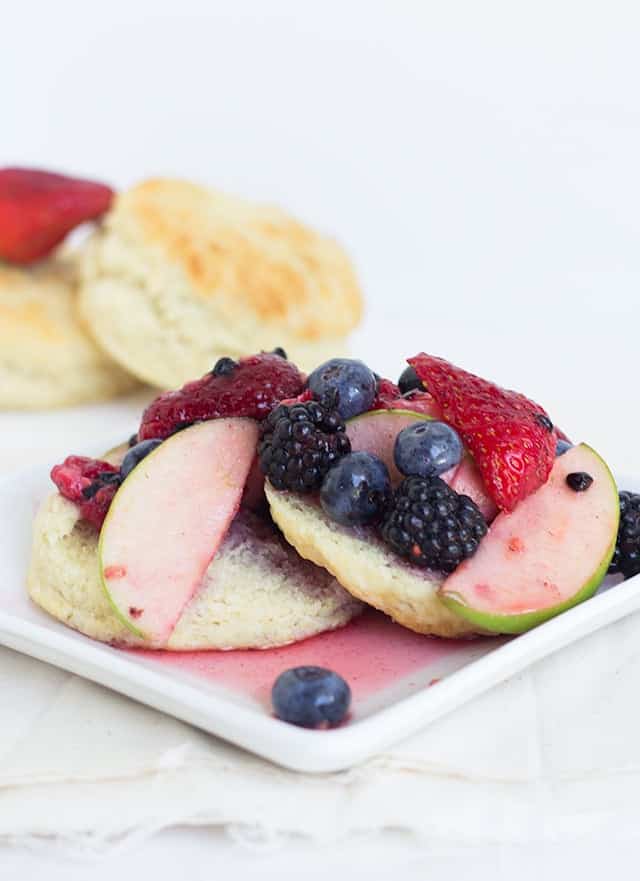 A plate of Redd's Apple Fruit Shortcake biscuits with berries on it.