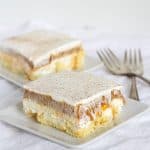 Two slices of No-Bake Twinkie Pumpkin Pie on a plate with a fork.