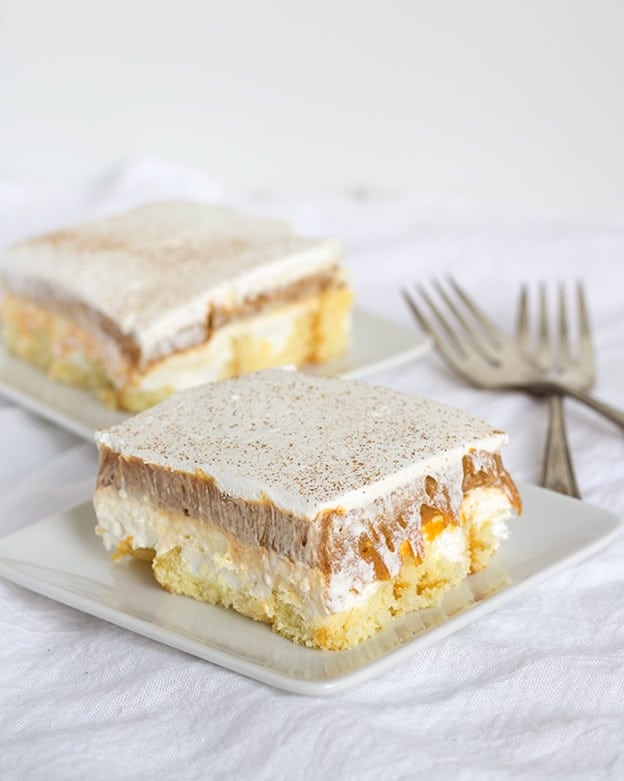 Two slices of No-Bake Twinkie Pumpkin Pie on a plate with a fork.
