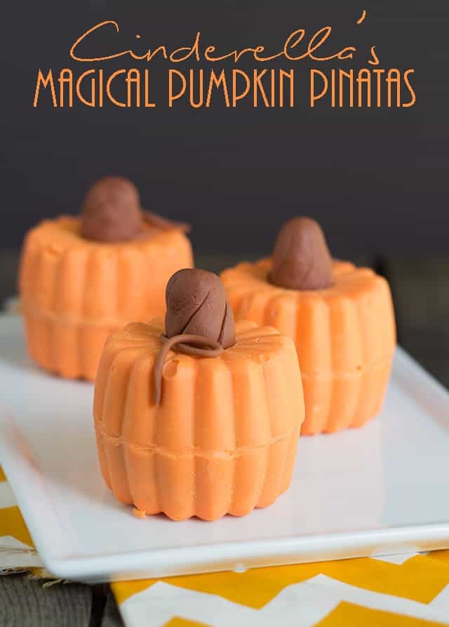 Cinderella's Magical Pumpkin Pinatas - Cute pinata pumpkins that are perfect to celebrate fall and inspired by the new Cinderella Movie! Stuff these guys with all the cute fall candy.