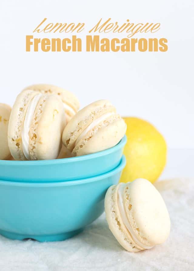 Lemon meringue macarons in a blue bowl.