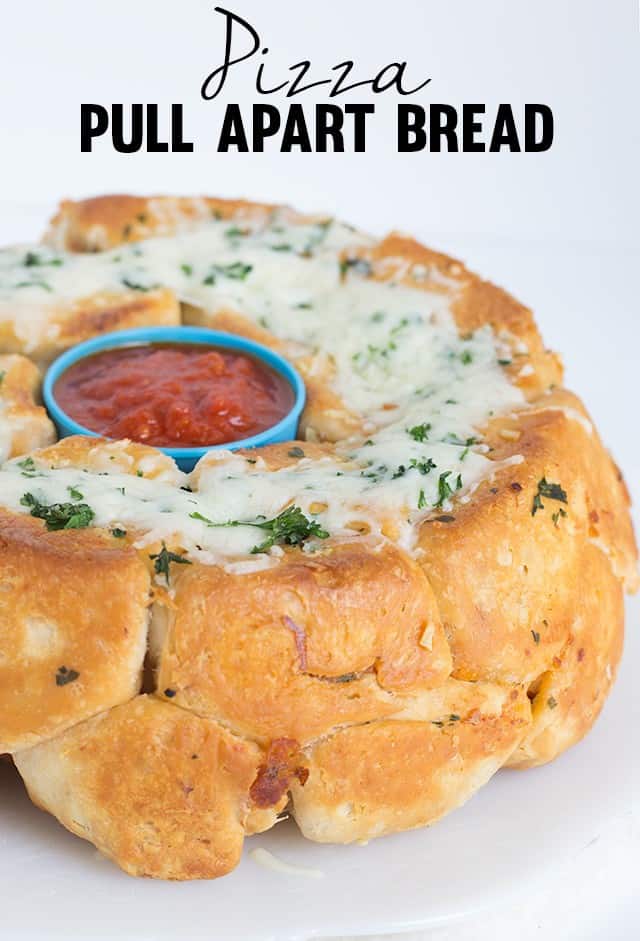 Pizza Pull Apart Bread - Fun pull apart bread with a delicious pizza filling and a garlicky exterior. This is a fun dinner if you have a little picky eater.