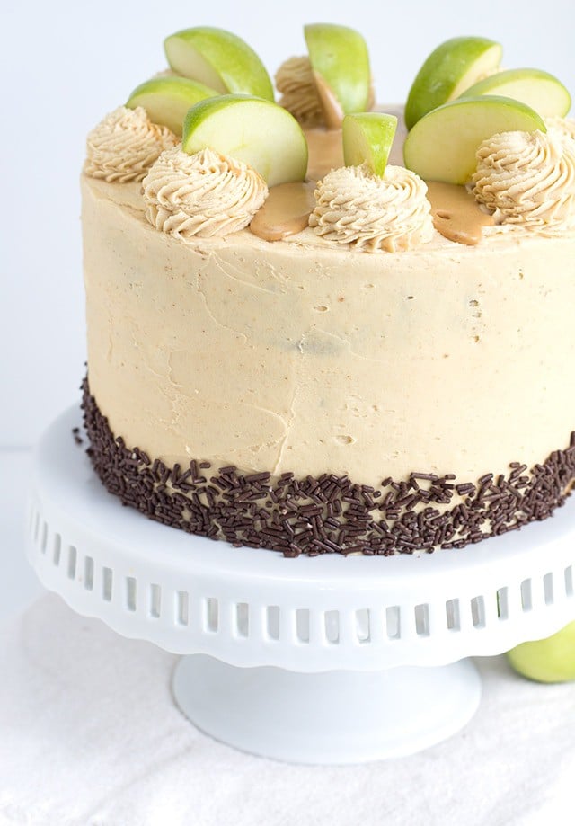 Apple Cake with Peanut Butter Frosting sitting on a white cake stand