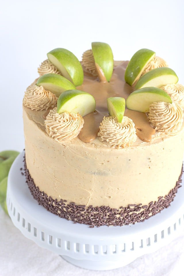 Apple Cake with Peanut Butter Frosting on a white cake stand