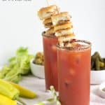 Grilled cheese garnished bloody mary with garlic bacon.