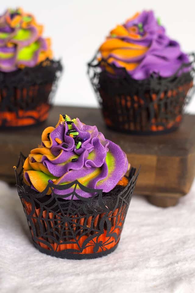 Three Halloween swirled cupcakes.