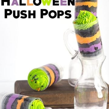 Easy Halloween push pops showcased on a rustic wooden board.