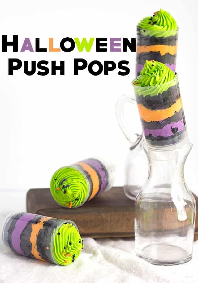 Easy Halloween push pops showcased on a rustic wooden board.