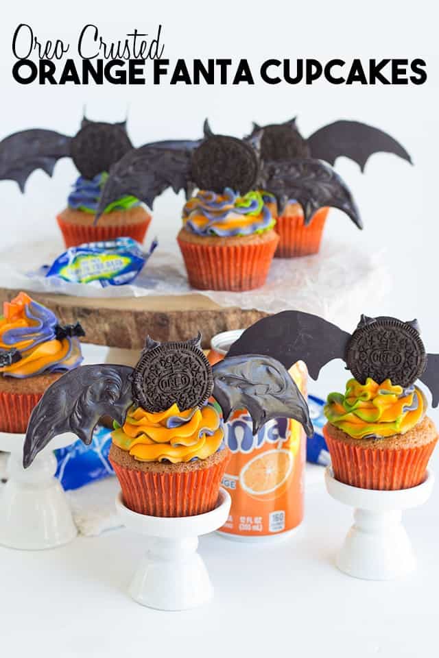 Oreo crusted orange fanta cupcakes with bats on top.