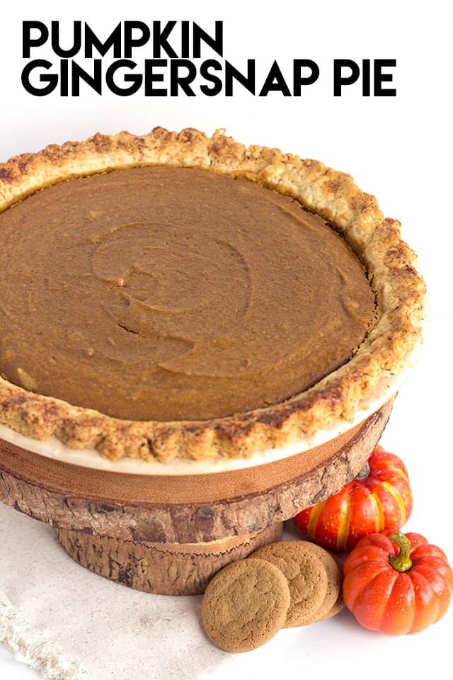 A tantalizing Pumpkin Gingersnap Pie presentation on a wooden board.