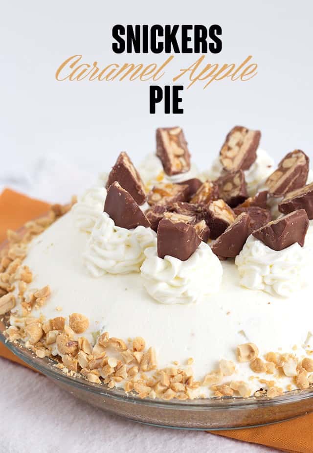 Snickers Caramel Apple Pie - delicious layers of cream cheese, caramel, crunchy, fresh apples and whipped cream. Best of all, it's topped with Snickers and peanuts. It's a quick and easy dessert too!